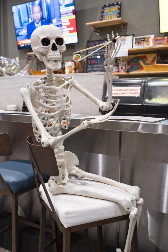 photo of a skeleton with sushi for photography portfolio