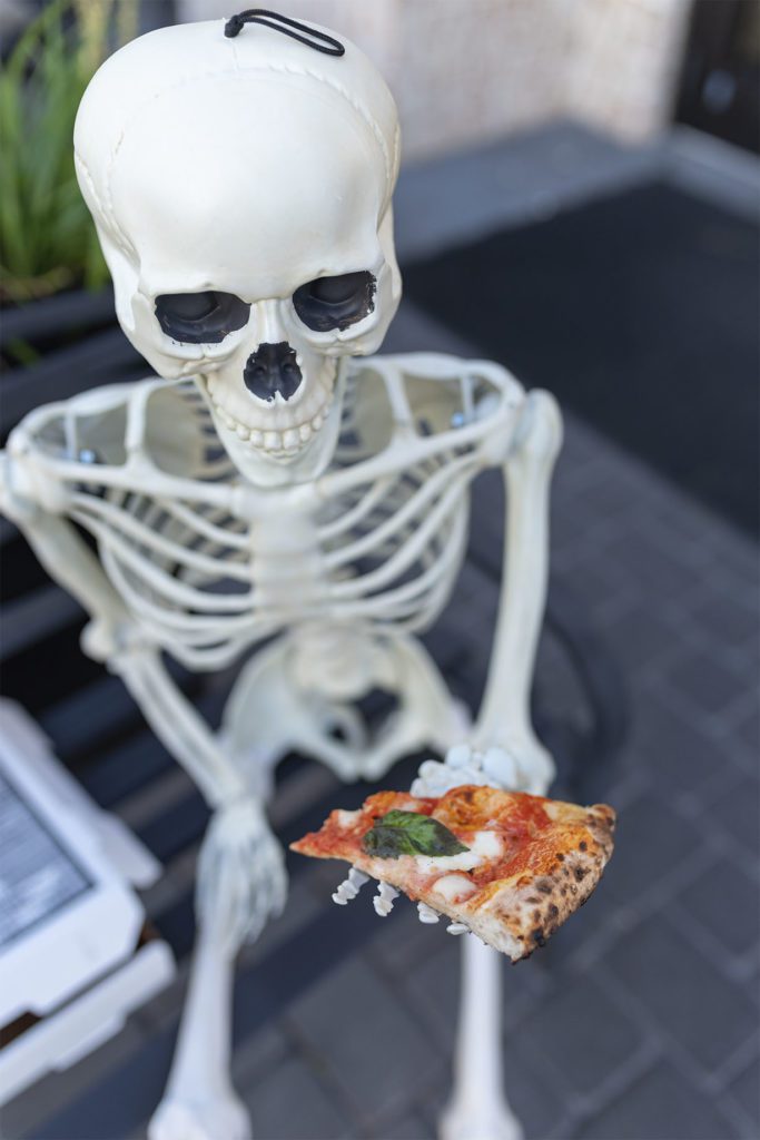 photo of a skeleton with pizza for photography portfolio